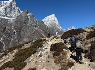 Valuable trekkers walking on Everest Base Camp trail with breathtaking Everest views