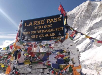 Trekkers crossing the rugged high-altitude trails of the Manaslu Circuit Trek approaching Larkya La Pass