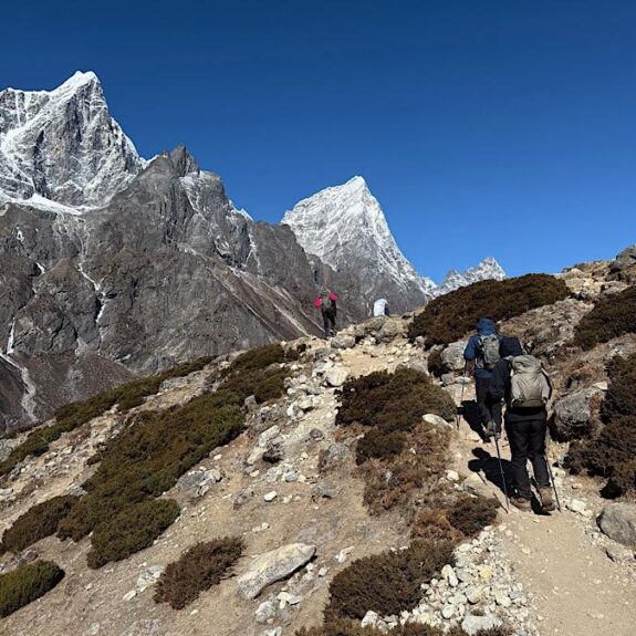 Hiker enjoying scenic Everest region mountains on trekking route