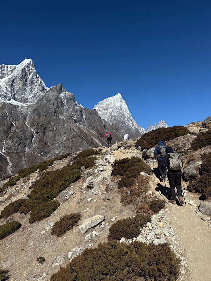 Hiker enjoying scenic Everest region mountains on trekking route