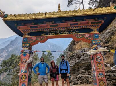 Trekkers standing at the main gate of Tsum Valley during the scenic Tsum Valley Trek in Nepal