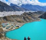 Panoramic view of Gokyo Lakes surrounded by snow-capped Everest region mountains during spring trek