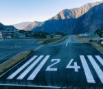 Lukla Airport in the Himalayas with trekkers and STOL planes ready for Everest Base Camp trek 2026