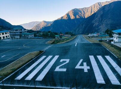 Lukla Airport in the Himalayas with trekkers and STOL planes ready for Everest Base Camp trek 2026